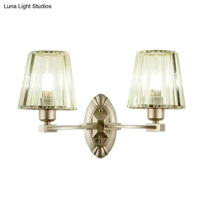 Double-arm wall sconce with brushed brass finish and green glass shades by Decorbites on Tampa Home & Garden Store