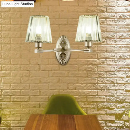 Two-light wall sconce in brushed brass with green glass shades by Decorbites on Tampa Home & Garden Store