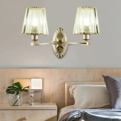 Decorbites modern brushed brass double-arm wall sconce with green glass shades for bedroom on Tampa Home & Garden Store