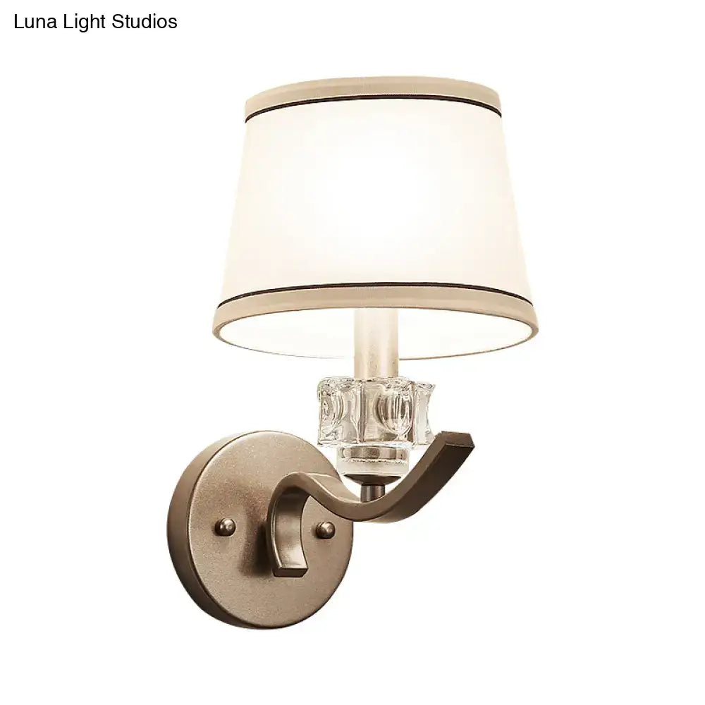 Brass crystal wall sconce with brushed bronze finish and cream fabric shade on Tampa Home & Garden Store