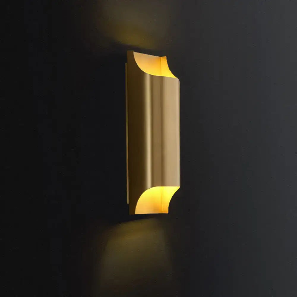 Brass Geometric Wall Sconce by Decorbites, gold finish with curved ends and warm glow on Tampa Home & Garden Store