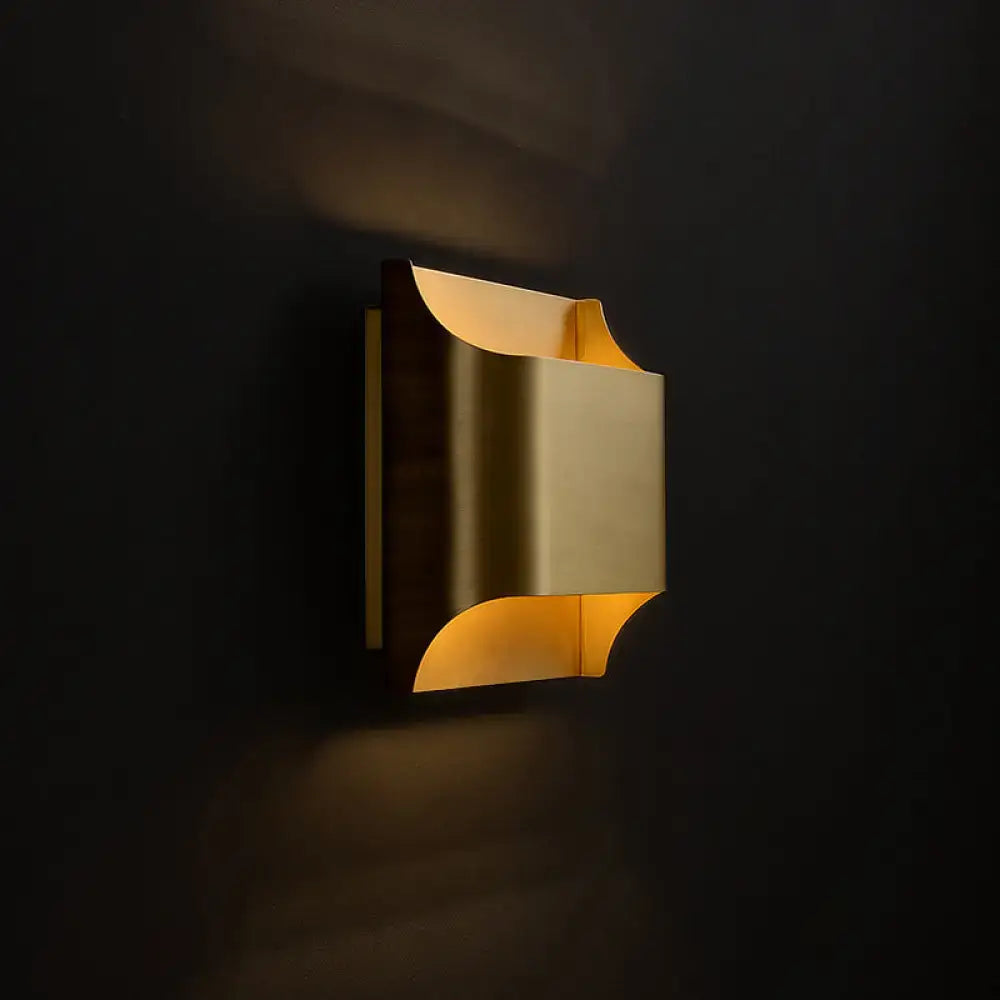 Brass geometric wall sconce by Decorbites, modern gold metal with curved cutouts on Tampa Home & Garden Store