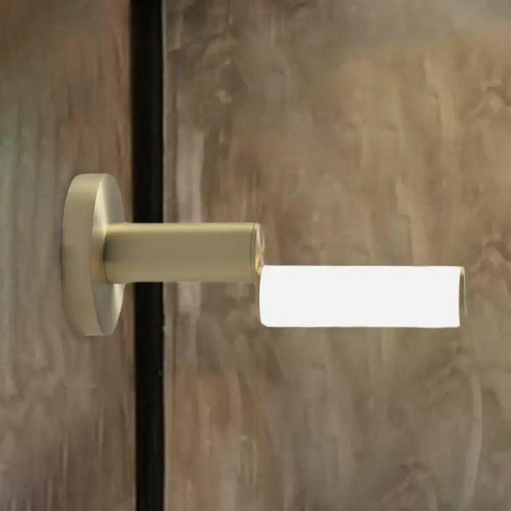 Gold metal wall light by Decorbites with brass finish and rectangular frosted shade on Tampa Home & Garden Store