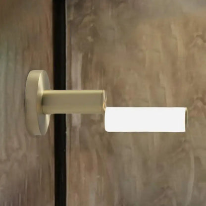 Gold metal wall light by Decorbites with brass finish and rectangular frosted shade on Tampa Home & Garden Store