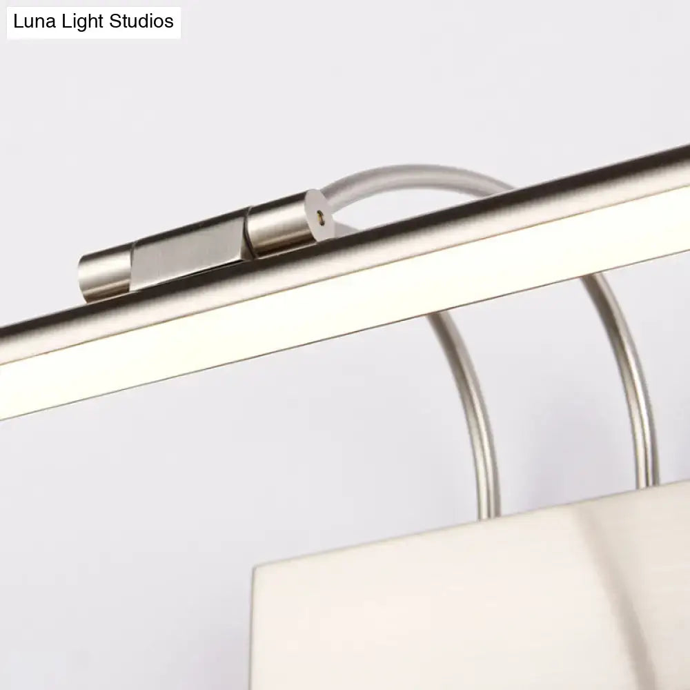Modern brushed brass LED bathroom wall light sconce with curved arm and white shade on Tampa Home & Garden Store