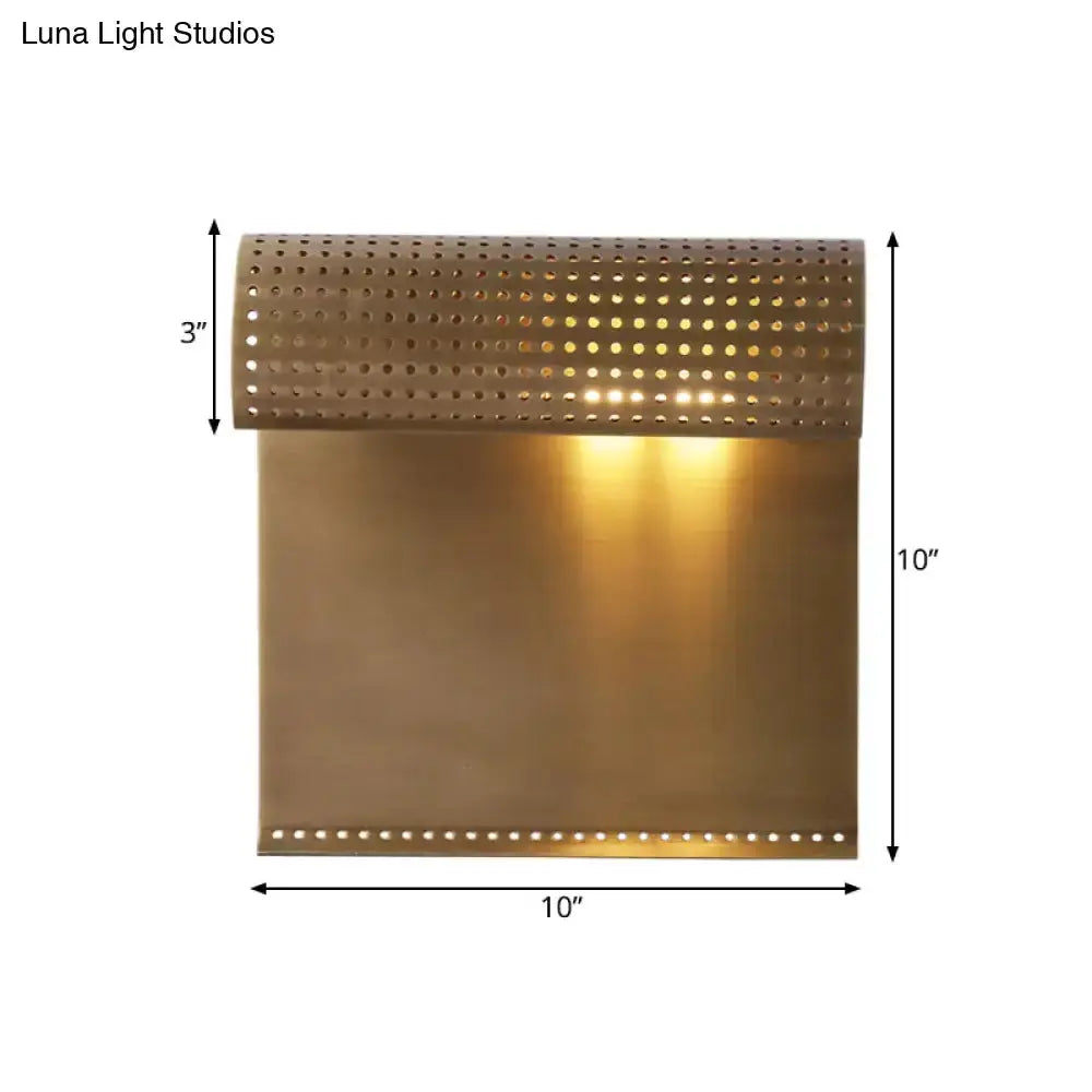 Modern brushed brass wall sconce with perforated curved top and smooth lower panel Decorbites on Tampa Home & Garden Store
