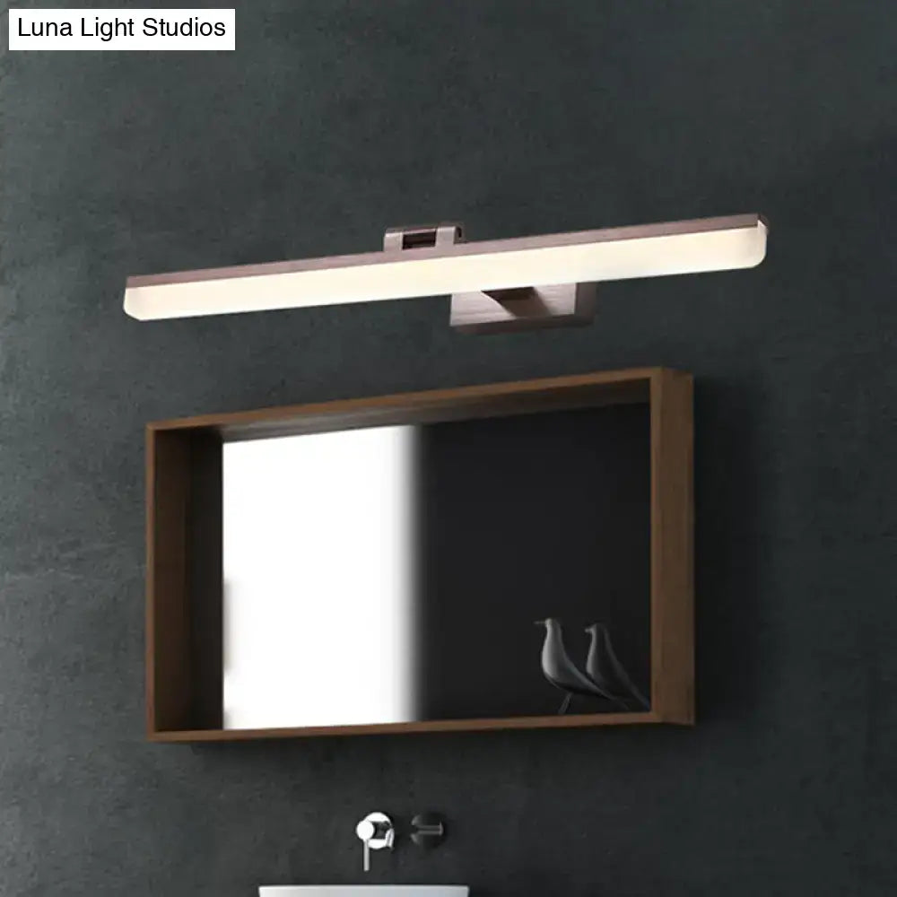 Modern brushed metal LED vanity sconce, wall-mounted horizontal bar above a wooden mirror on Tampa Home & Garden Store