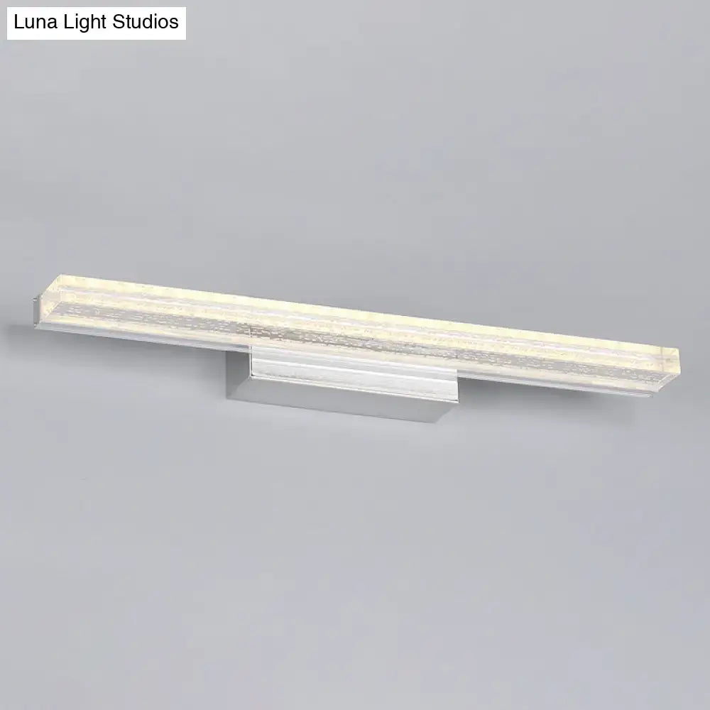 Metallic LED vanity sconce with silver metal bar and frosted diffuser on Tampa Home & Garden Store