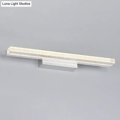 Metallic LED vanity sconce with silver metal bar and frosted diffuser on Tampa Home & Garden Store