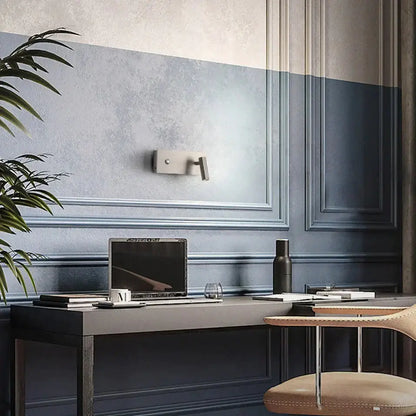 Decorbites nickel dimmable wall light sconce mounted on blue paneled wall on Tampa Home & Garden Store