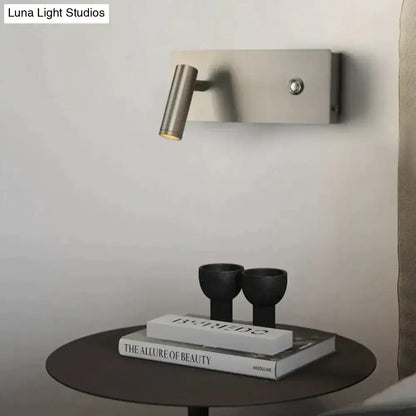 Nickel dimmable wall light; adjustable cylindrical sconce above a table on Tampa Home & Garden Store