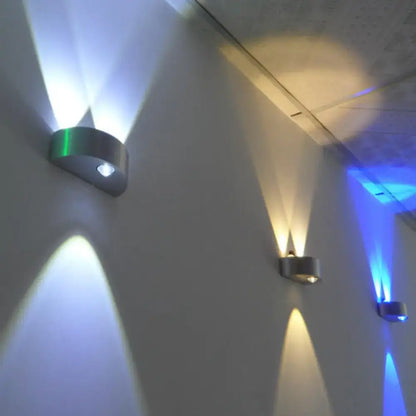 Silver LED flush wall sconces by Decorbites; wall mounted, emits upward/downward blue light on Tampa Home & Garden Store