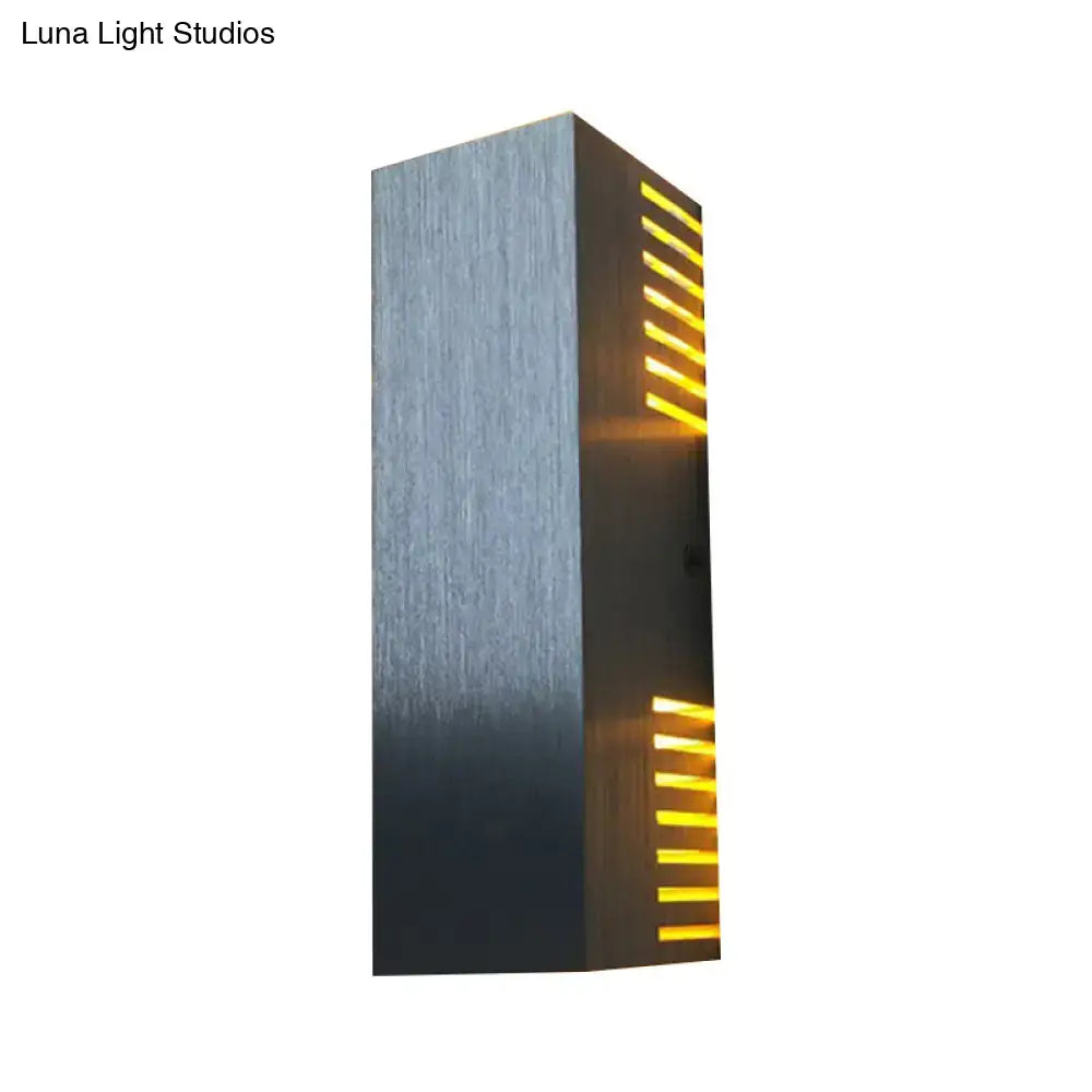 Silver metal wall light sconce with amber horizontal slits, modern industrial design on Tampa Home & Garden Store