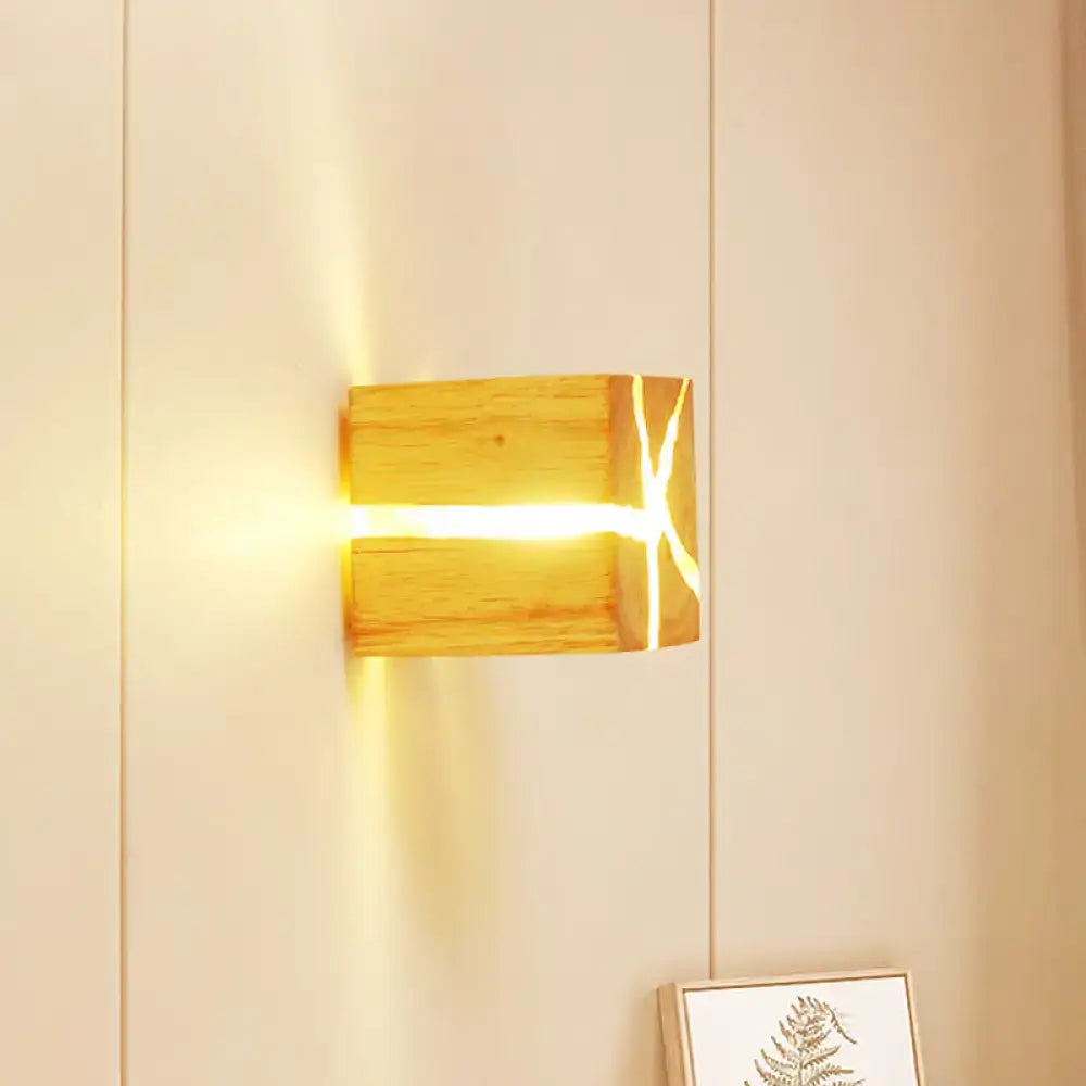 Wooden cube wall light by Decorbites; natural wood finish with warm glow from the seam on Tampa Home & Garden Store