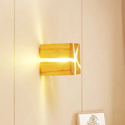 Wooden cube wall light by Decorbites; natural wood finish with warm glow from the seam on Tampa Home & Garden Store