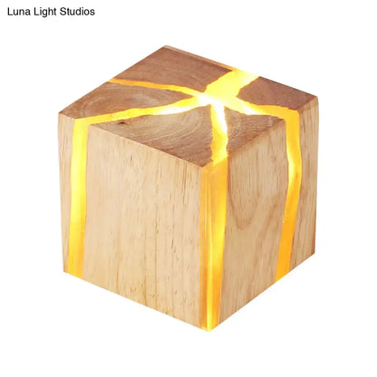 Wooden cube wall light with wood grain and warm amber glow along cracks by Decorbites on Tampa Home & Garden Store