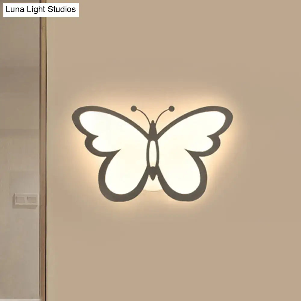 White acrylic butterfly wall sconce with backlit glow on Tampa Home & Garden Store