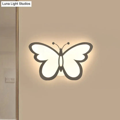 White acrylic butterfly wall sconce with backlit glow on Tampa Home & Garden Store
