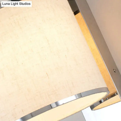 Chrome Fabric Drum Sconce with beige shade and chrome trim by Decorbites on Tampa Home & Garden Store