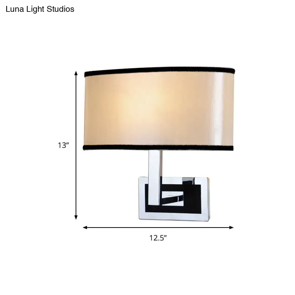 Chrome Oval Wall Sconce with beige fabric shade and black trim by Decorbites on Tampa Home & Garden Store