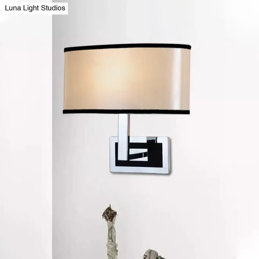 Decorbites Chrome Oval Wall Sconce with beige shade and black trim on backplate on Tampa Home & Garden Store