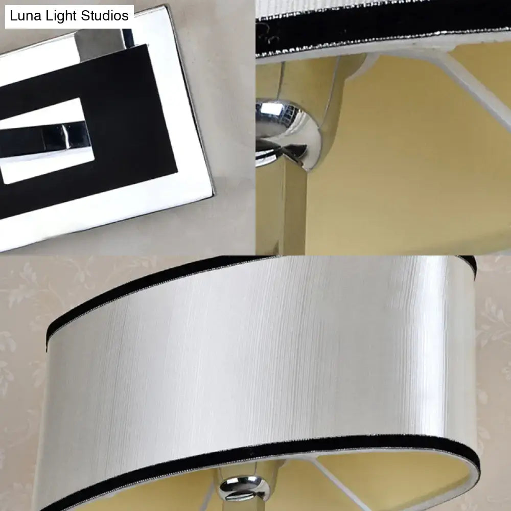 Chrome oval wall sconce by Decorbites with white drum shade and chrome finish on Tampa Home & Garden Store