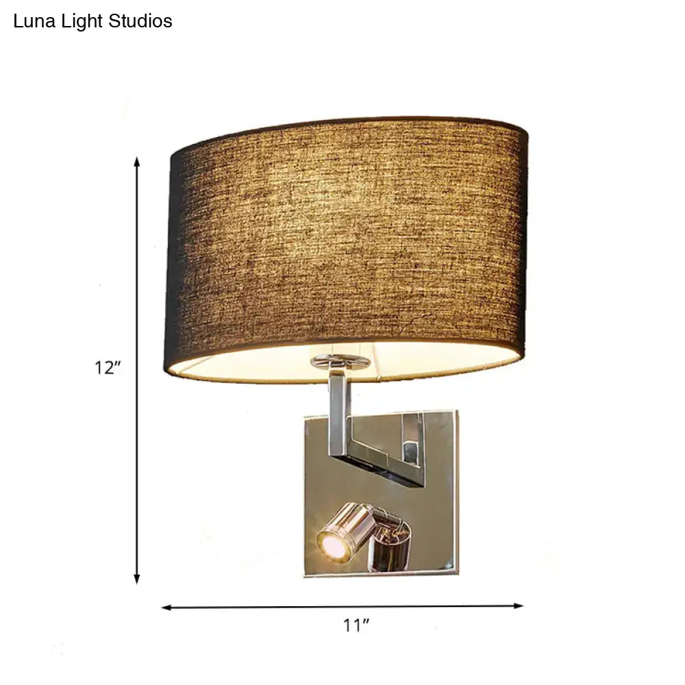 Brown fabric wall sconce with chrome backplate and single spotlight on Tampa Home & Garden Store