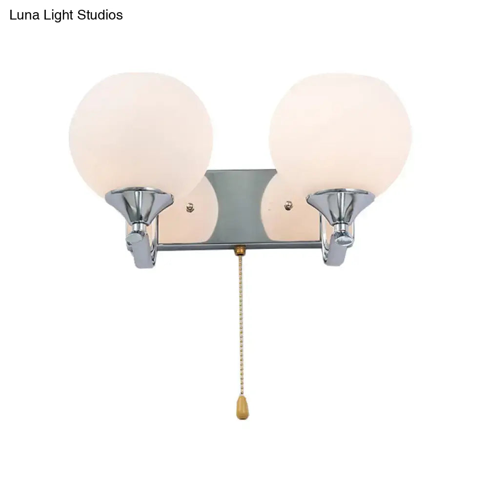 Decorbites chrome cream glass pull-chain sconce with two frosted globes on Tampa Home & Garden Store