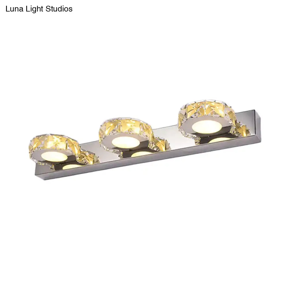 Chrome gold crystal vanity light with three faceted crystal rings on a chrome bar by Decorbites on Tampa Home & Garden Store