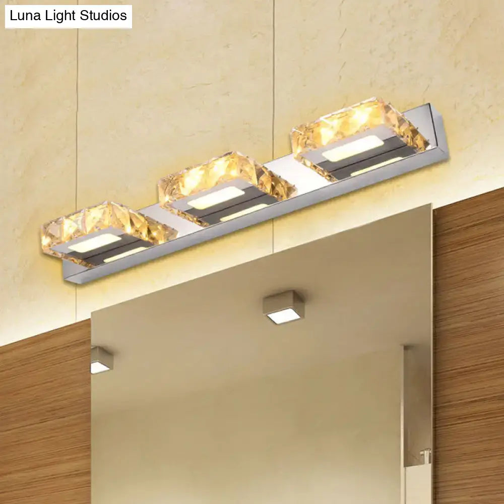 Chrome-gold crystal vanity light by Decorbites with cube shades on chrome bar above mirror on Tampa Home & Garden Store