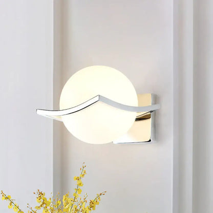 White glass globe sconce with chrome curved arm on square backplate Decorbites on Tampa Home & Garden Store