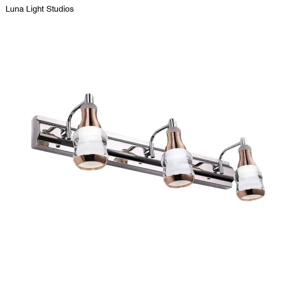Three-light vanity wall light fixture in chrome with rose-gold accents Decorbites on Tampa Home & Garden Store