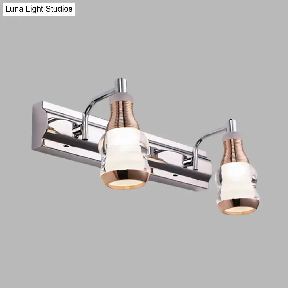 Modern chrome and rose gold vanity wall light bathroom fixture with two glass shades on Tampa Home & Garden Store