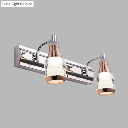 Modern chrome and rose gold vanity wall light bathroom fixture with two glass shades on Tampa Home & Garden Store