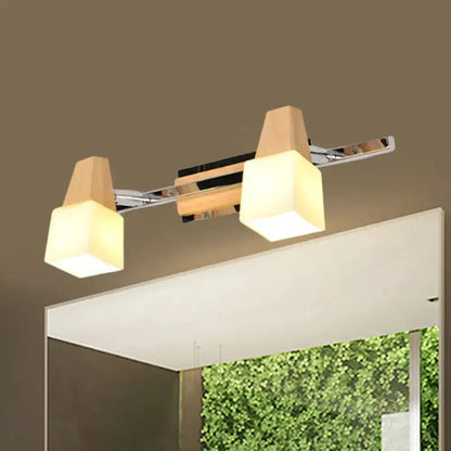 Modern chrome and wood cube vanity light fixture with frosted cube shades mirror Decorbites on Tampa Home & Garden Store
