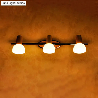 Glass Dome Vanity Sconce by Decorbites with 3 frosted glass shades on a metal bar on Tampa Home & Garden Store