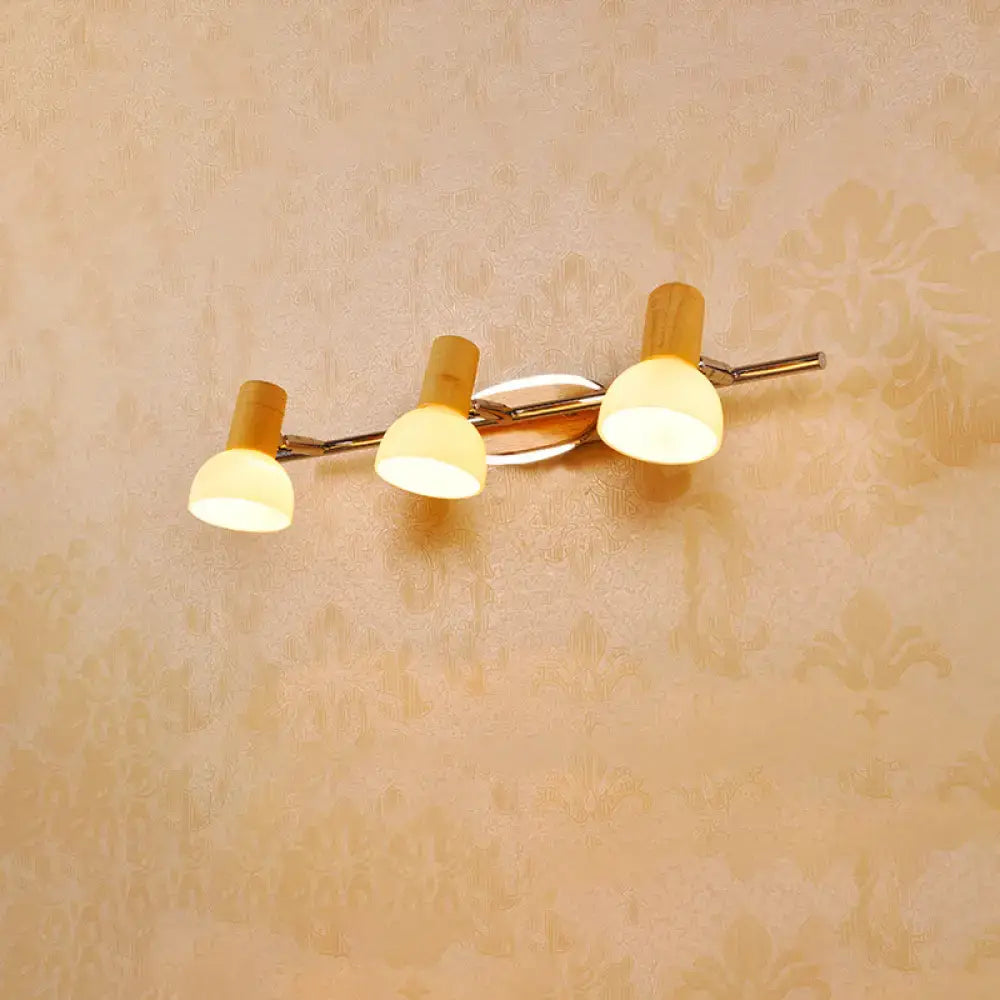 Glass Dome Vanity Sconce by Decorbites, three frosted glass shades on a curved chrome bar on Tampa Home & Garden Store