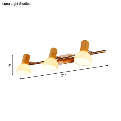 Glass Dome Vanity Sconce with three cream glass shades on wood bar, 21in wide on Tampa Home & Garden Store