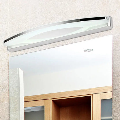 Chrome arc LED vanity light with acrylic diffuser by Decorbites above bathroom mirror on Tampa Home & Garden Store