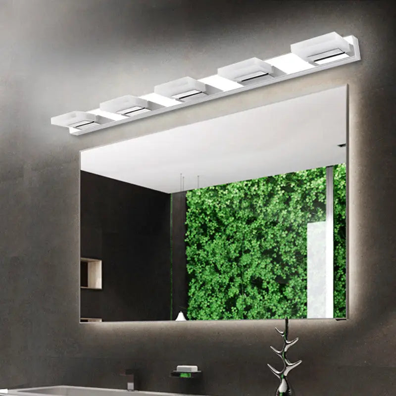 Chrome vanity light bar with five acrylic square shades over a bathroom mirror on Tampa Home & Garden Store