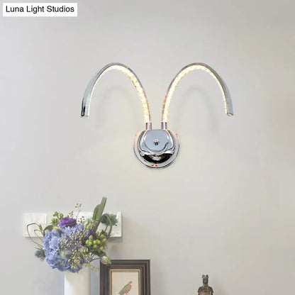 Chrome crystal wall sconce with dual curved arms on Tampa Home & Garden Store