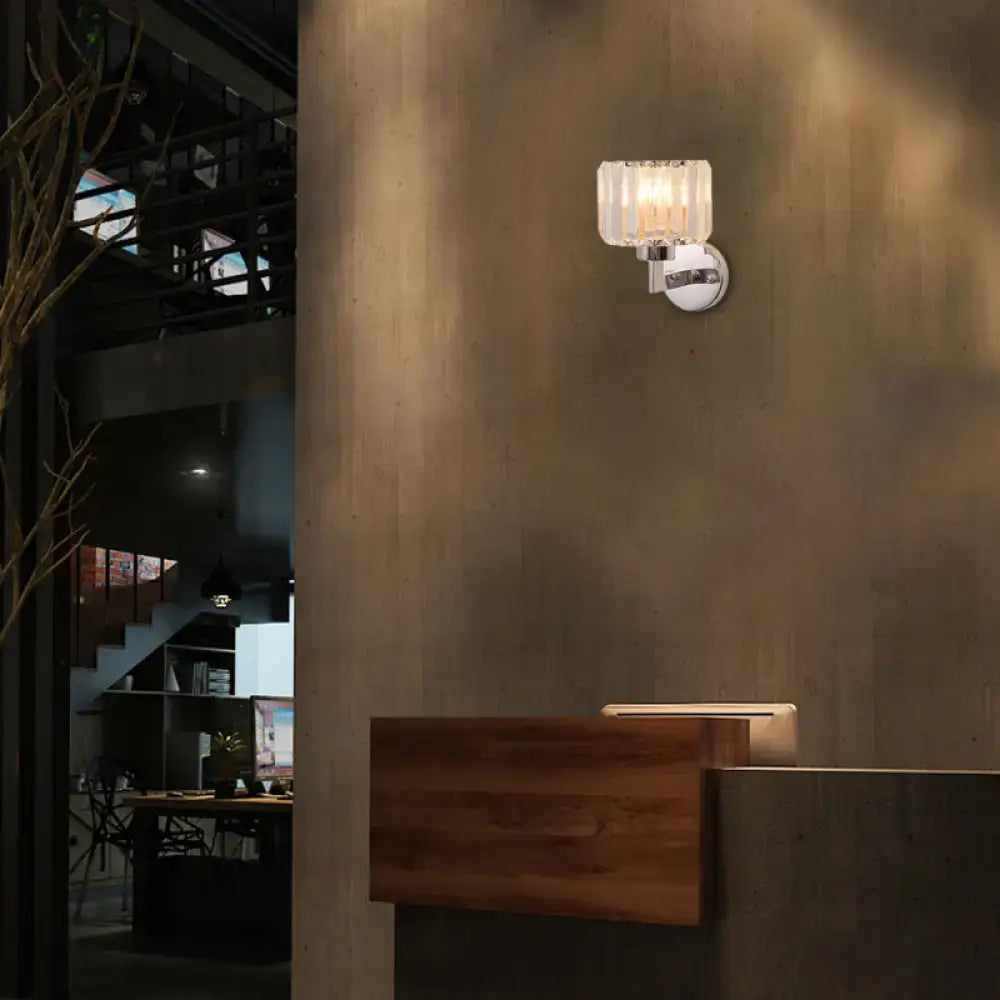 Chrome crystal wall sconce with ribbed glass shade mounted on a round metal backplate on Tampa Home & Garden Store