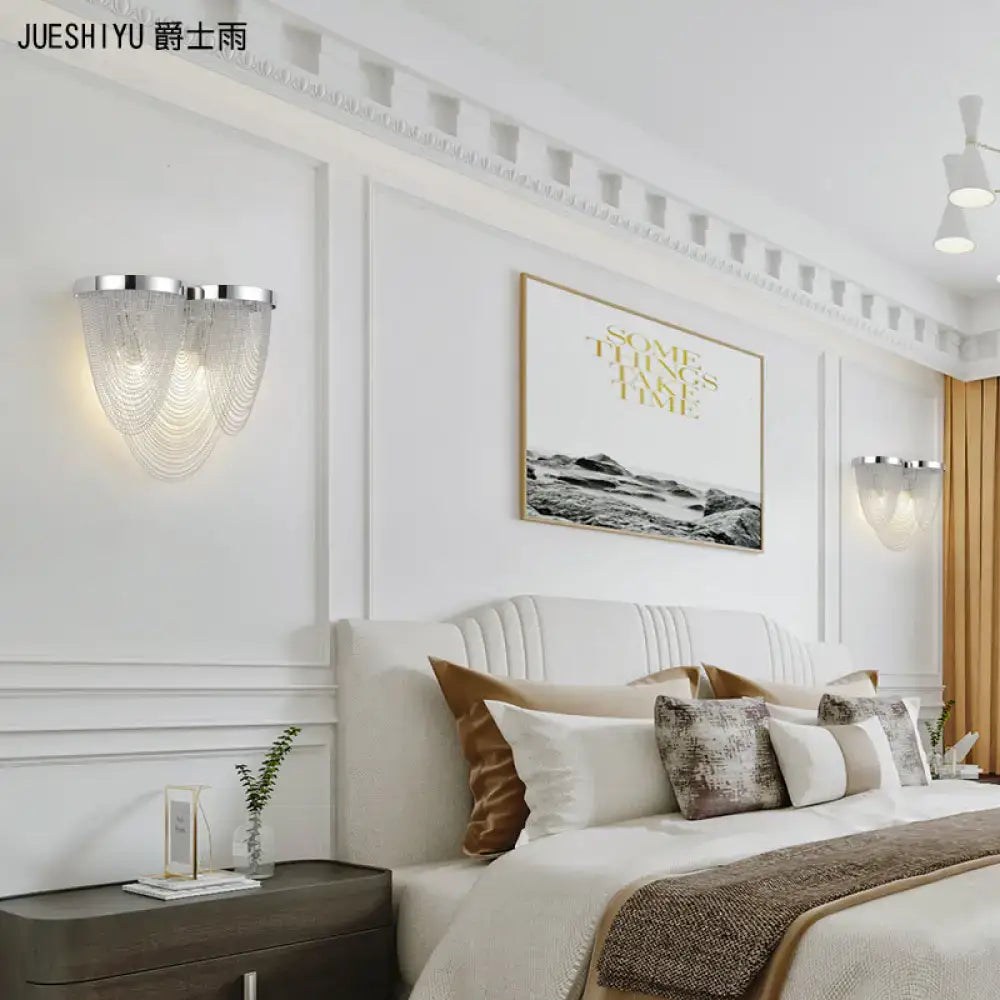 Aluminum chrome wall light dual-light G9 with beaded chain shade, mounted beside bed on Tampa Home & Garden Store