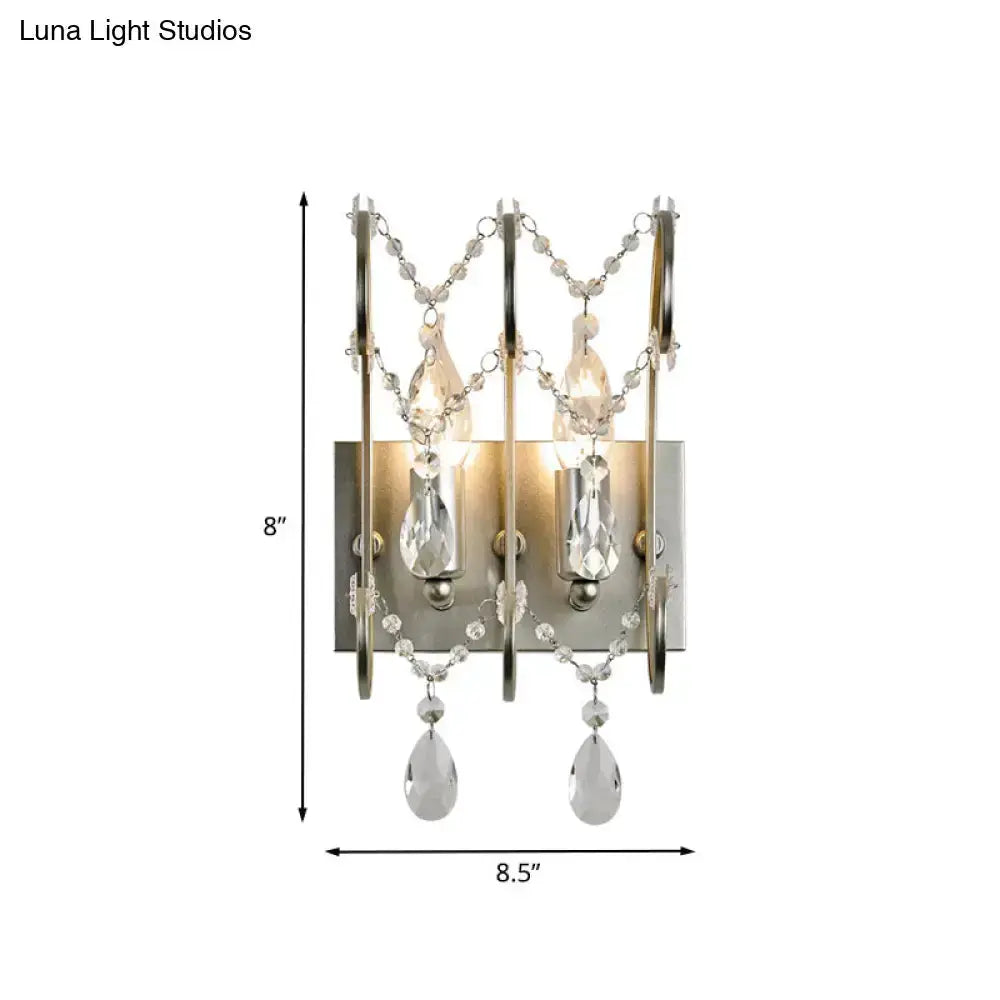 Decorbites dual-light chrome crystal wall sconce with teardrop prisms for bedroom lighting on Tampa Home & Garden Store