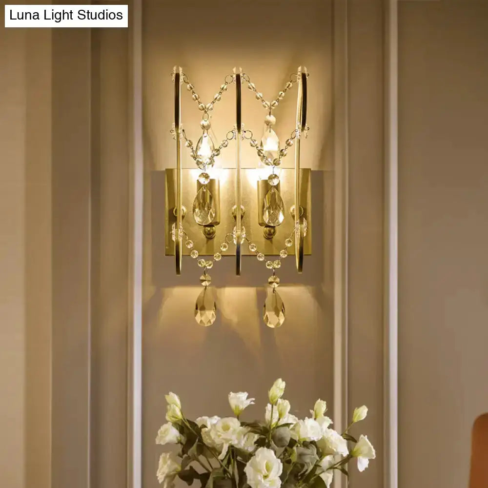 Decorbites chrome crystal wall sconce with teardrop prisms and bead chains on backplate on Tampa Home & Garden Store