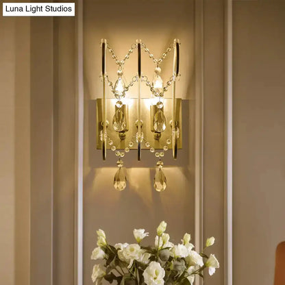 Decorbites chrome crystal wall sconce with teardrop prisms and bead chains on backplate on Tampa Home & Garden Store