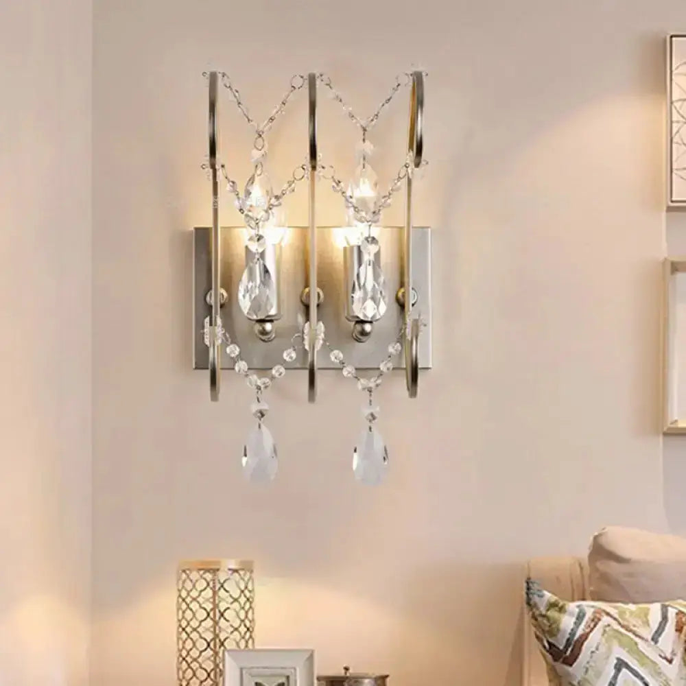Modern chrome crystal wall sconce light by Decorbites, two-light teardrop prisms on Tampa Home & Garden Store