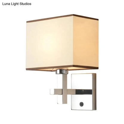 Modern chrome fabric LED wall sconce with square beige fabric shade and chrome backplate on Tampa Home & Garden Store