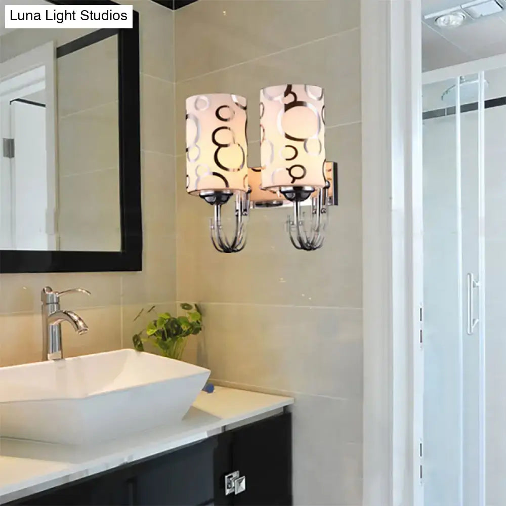 Chrome Glass Wall Sconce with dual lamps and circular-patterned glass shades in bathroom on Tampa Home & Garden Store
