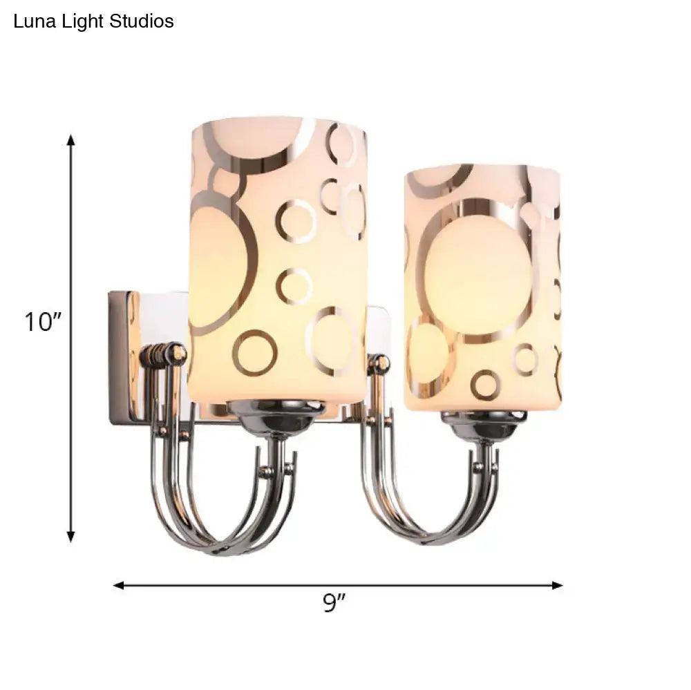 Decorbites two-light chrome glass wall sconce with circular-pattern glass shades on Tampa Home & Garden Store